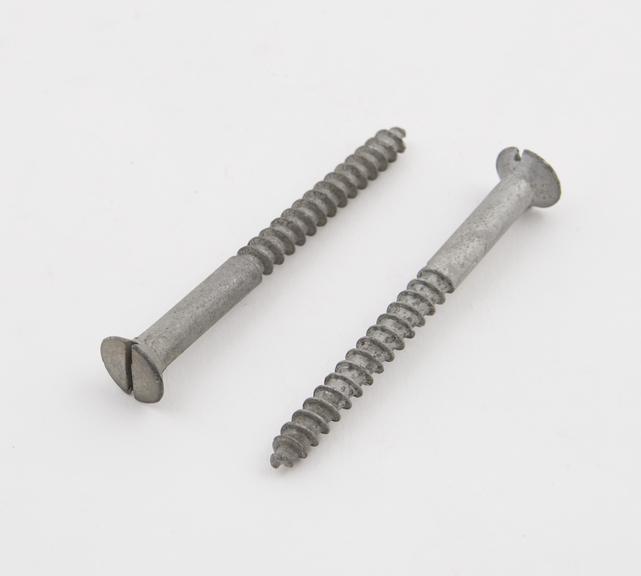 Two screws, 63mm long, sherardized by Cowper Coles