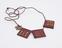 Amuletic necklace comprising 3 red leather amulet cases and a