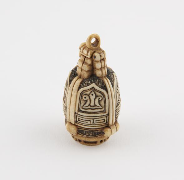 Bone container, in form of a bell, elaborately carved