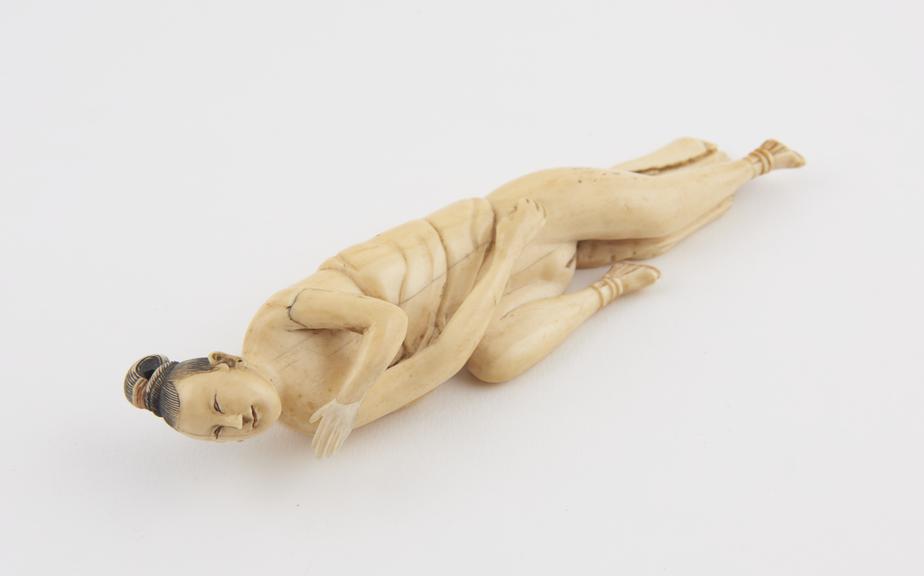 Ivory diagnostic figure, in the form of a recumbent woman