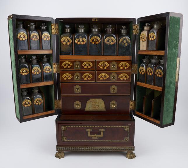 Medicine chest with key, winged front