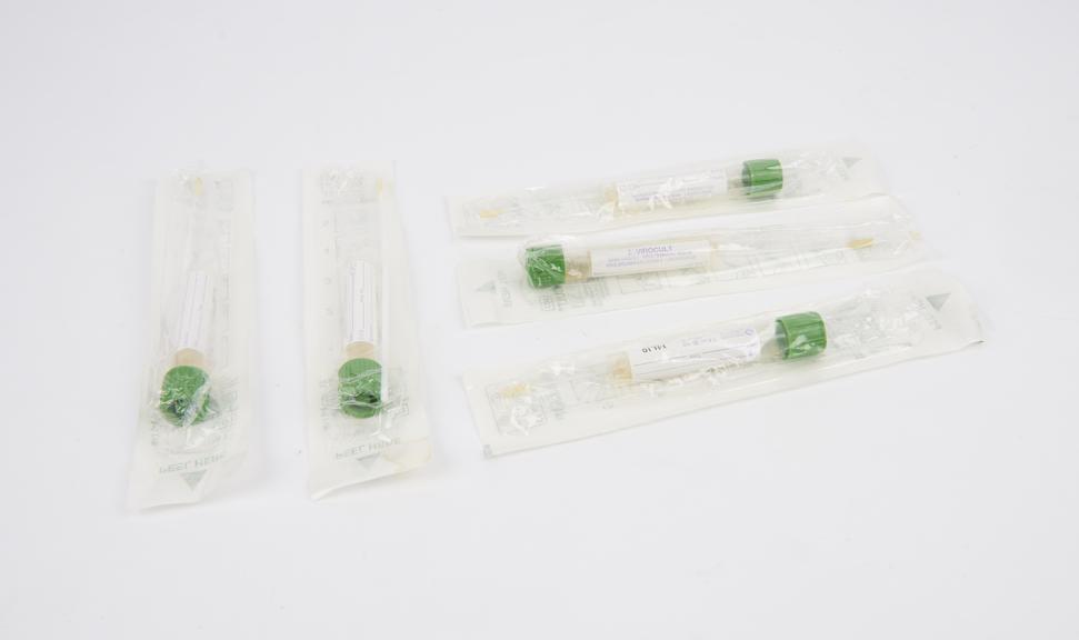 Five disposable swabs in sealed packaging