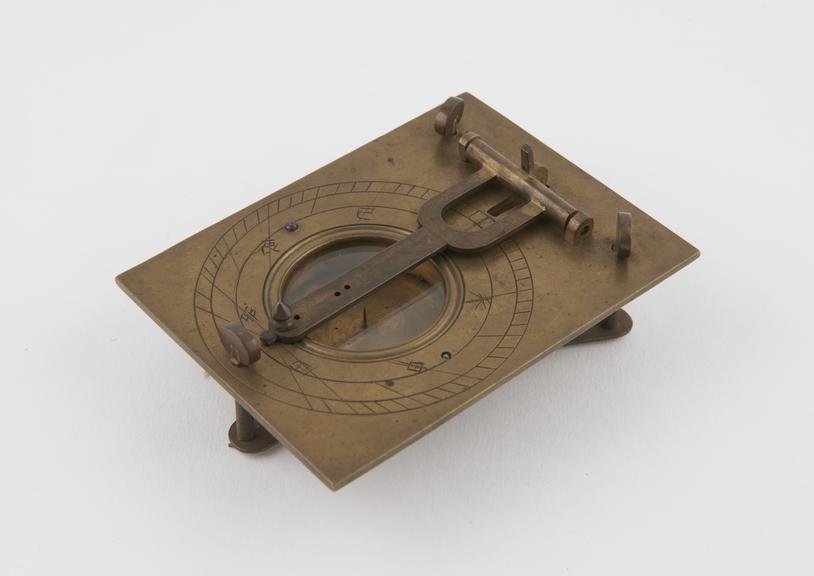 Brass compass with sundial pointer, clamp to secure instrument