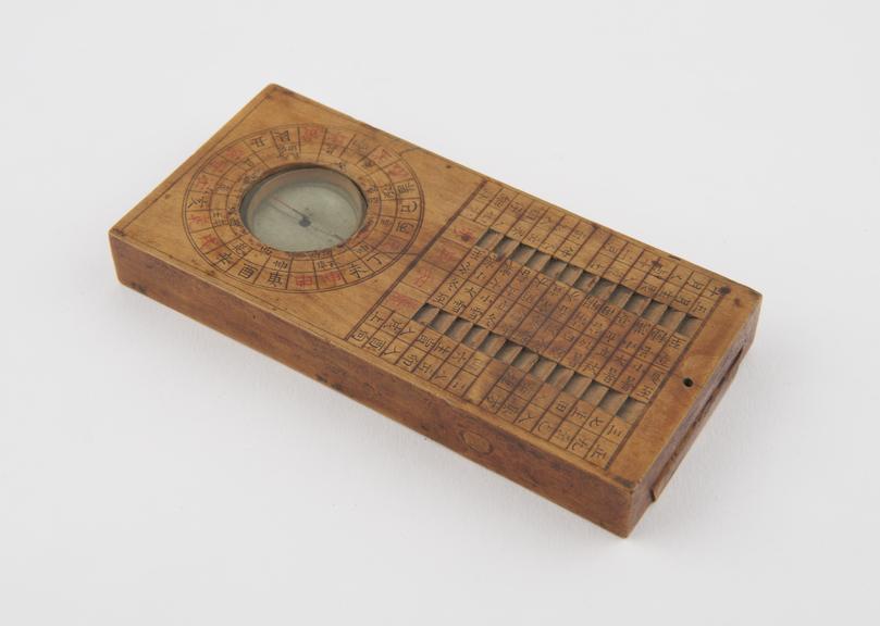 Sundial and compass on rectangular wooden base