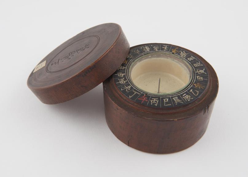 Compass in circular wooden case with lid