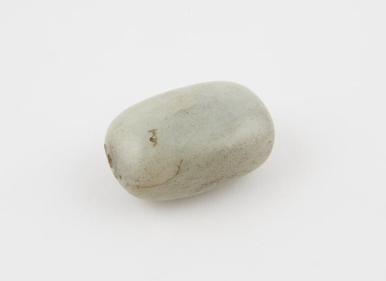 Ovoid, greyish stone with hollow centre