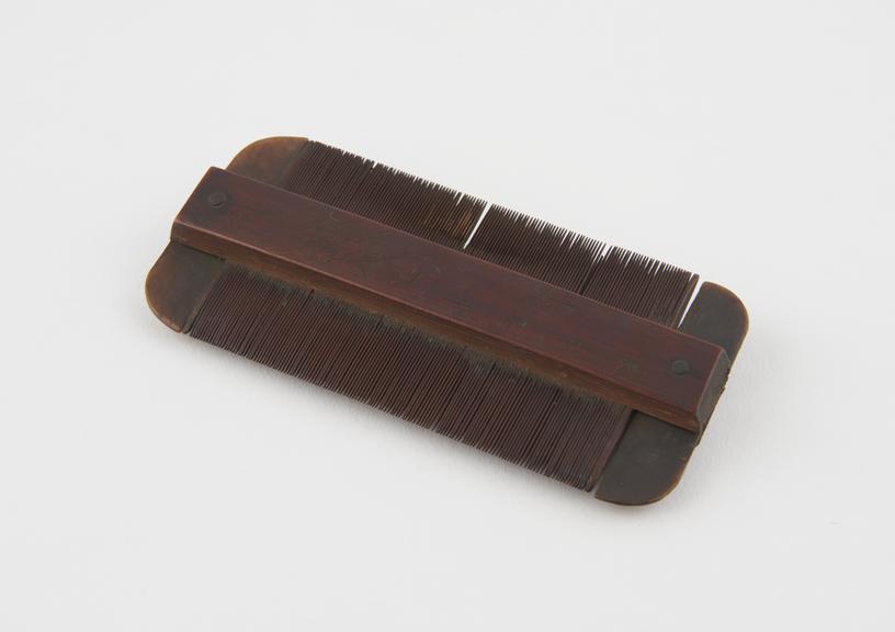 Double-sided wooden comb with tortoiseshell ends