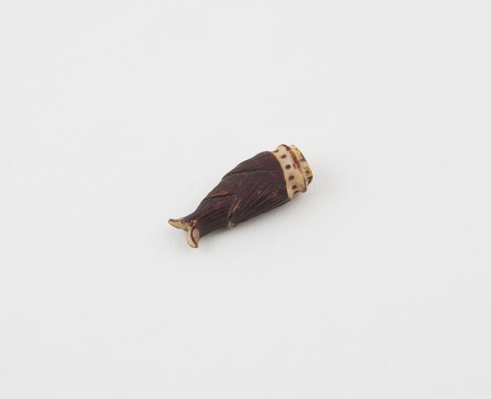 Carved and painted ivory (?) fish pendant, amuletic