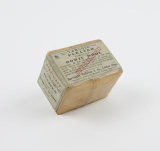 "Tabloid" compressed boric wool