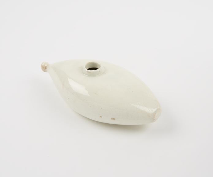Cream coloured boat shaped infant's feeding bottle, Crellin 4
