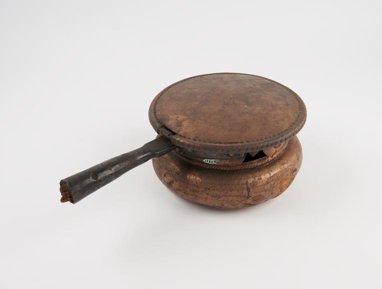 Copper warming pan for hot embers, shaped like Beefeater hat