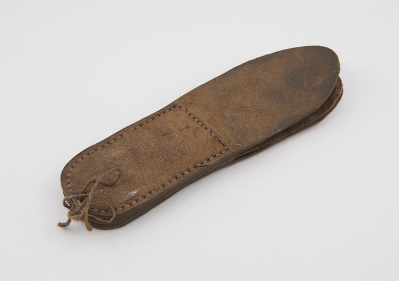 Leather lip-smacker, reputedly Chinese, 1801-1900