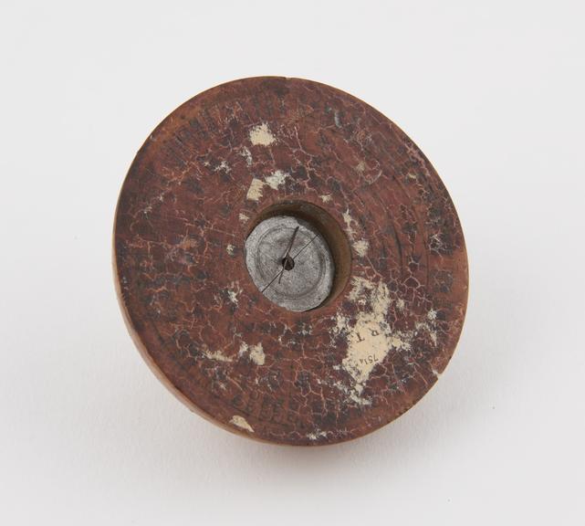 Circular wooden compass, inscribed with Chinese characters