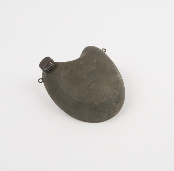 Small heatshaped pewter hot water bottle, with screw cap