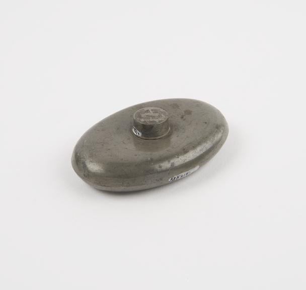 Small oval pewter hot water bottle with screw cap