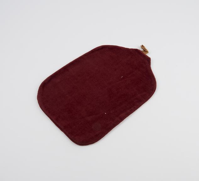 Hot water bottle cover, maroon velvet, English, 1920-1950