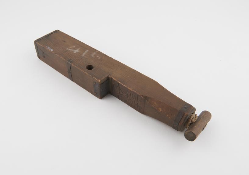 Rectangular wooden syringe with copper spray