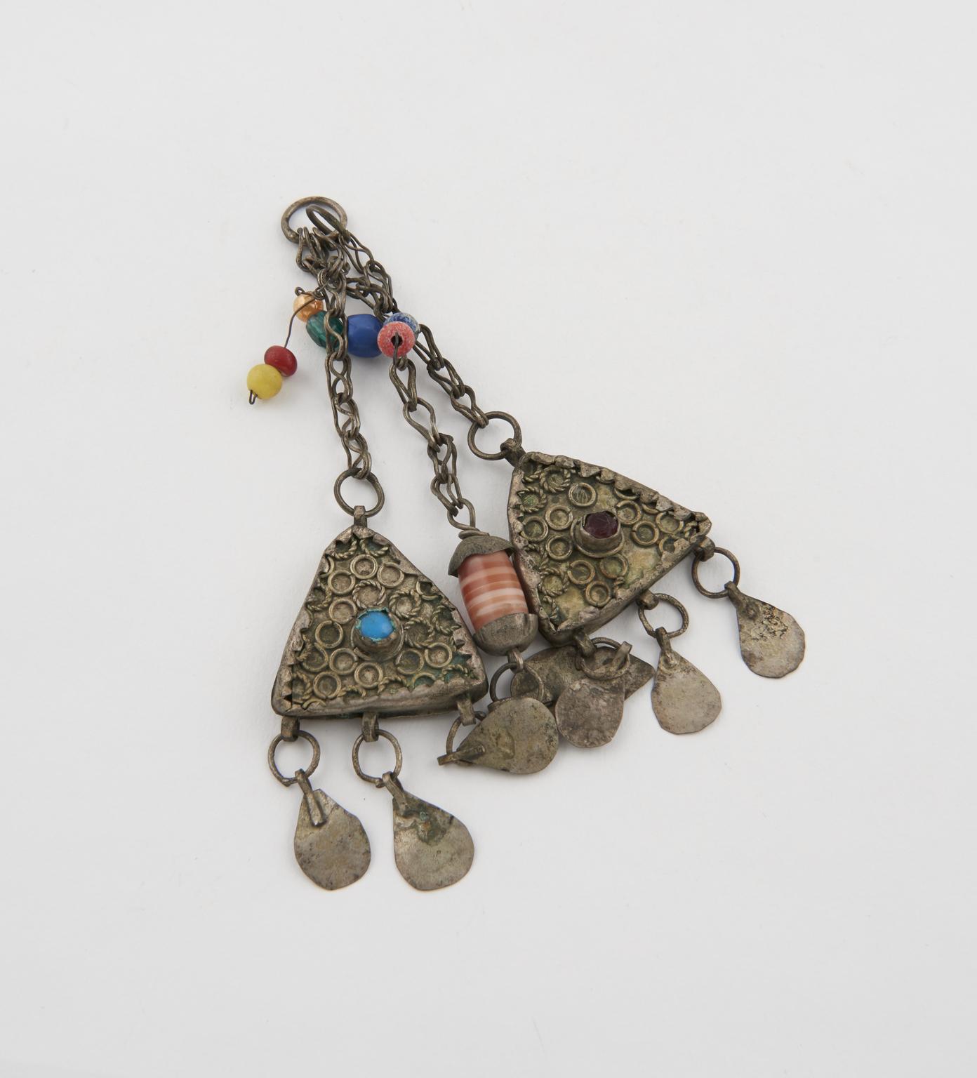2 triangular metal amulets | Science Museum Group Collection
