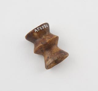 One lip-plug, concertina shaped