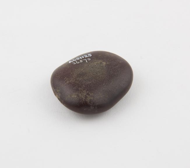 Amulet, of reddish brown, horse eye seed, Central Africa