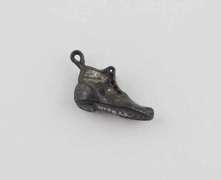 Small metal boot, used as amulet