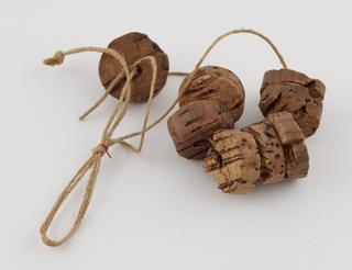 Piece of cord threaded with cork discs