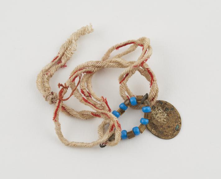 Child's amuletic necklace, with bead aureole