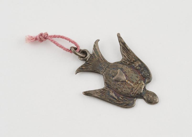 Small cut silver pendant of dove, wings partially outspread