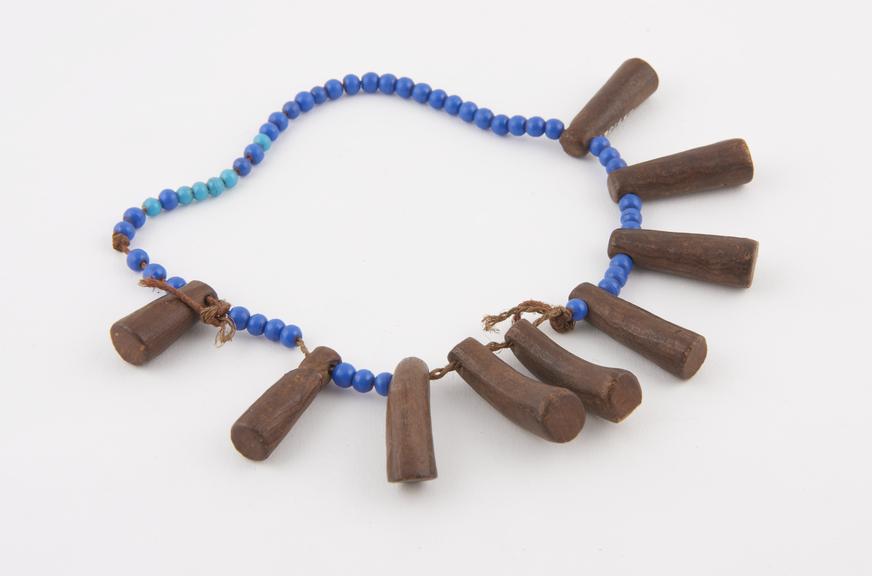 Amuletic necklace of light and dark blue beads interspersed