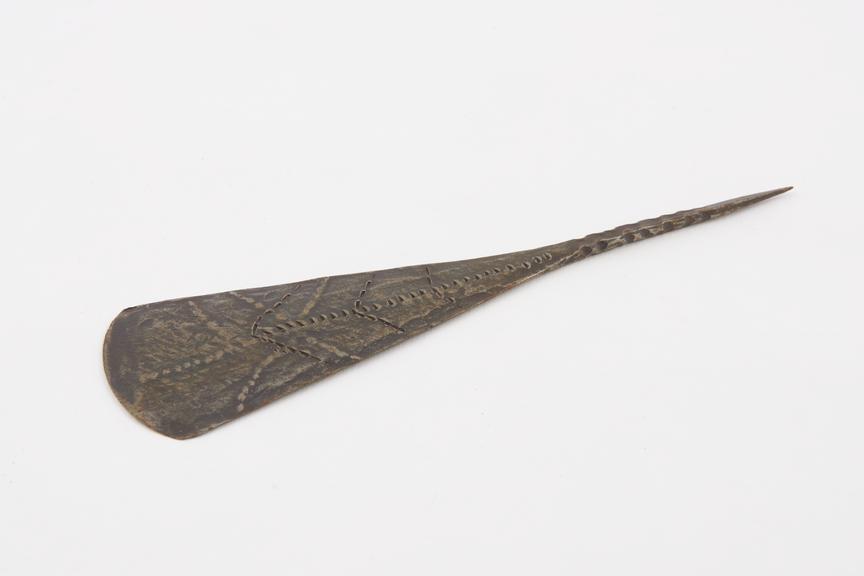 Metal razor with cuneiform blade sharp at base and spike handle