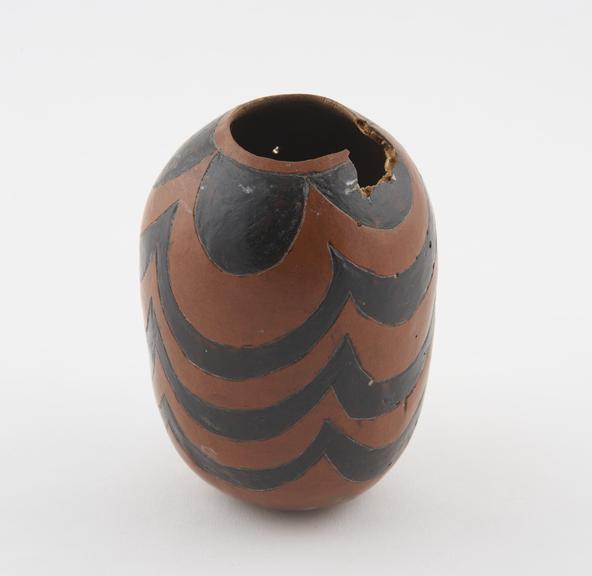 Gourd vessel, ovoid, with curving black designs