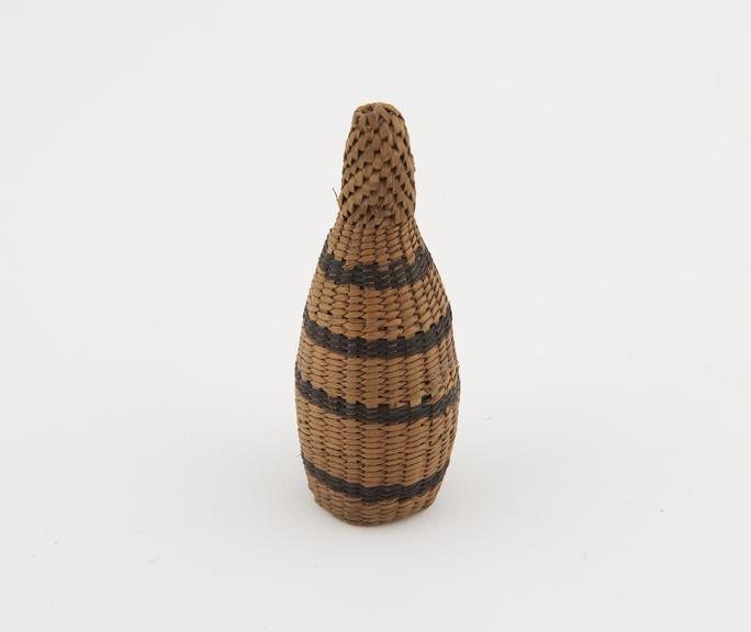 Grass basketry penis sheath, bottle shaped, finely woven