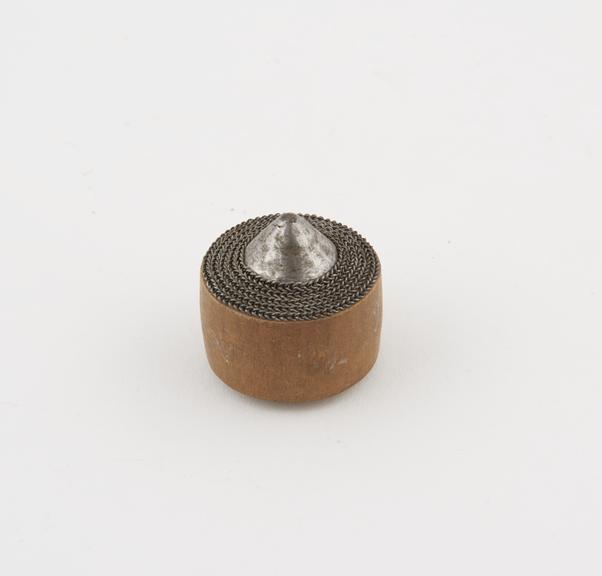 Wooden ear plug with steel face