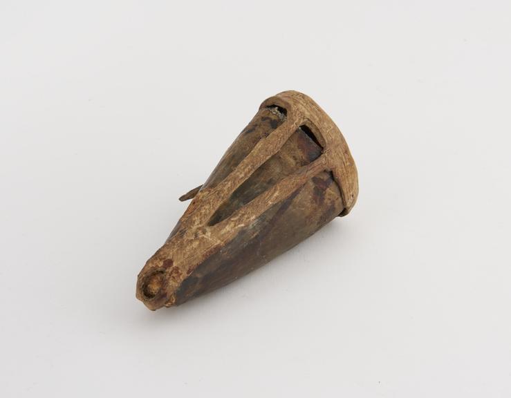 Horn amulet with hide lid containing cloth