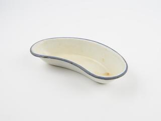 White kidney dish with a blue rim