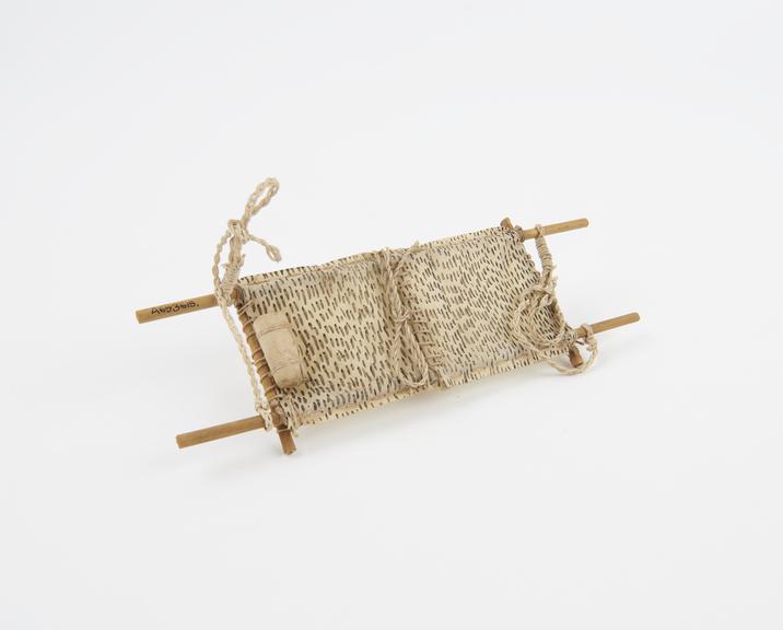 Model stretcher, cane, tissue paper and string