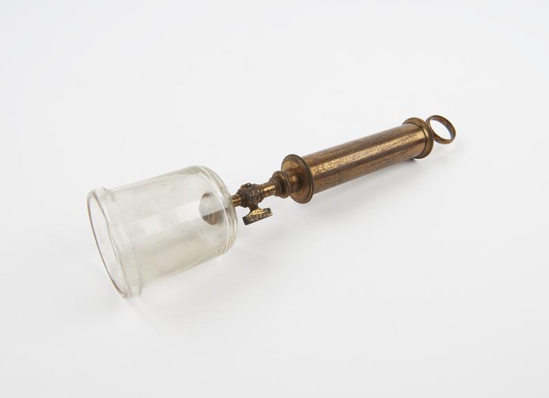 Cupping glass with brass exhausting syringe