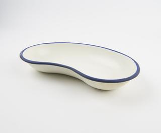 White kidney dish with a blue rim