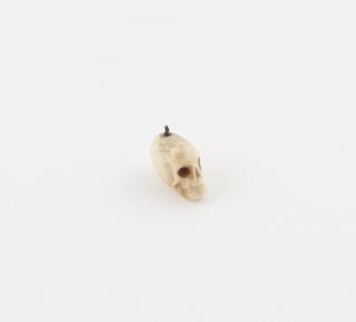 Amuletic model of skull for suspension