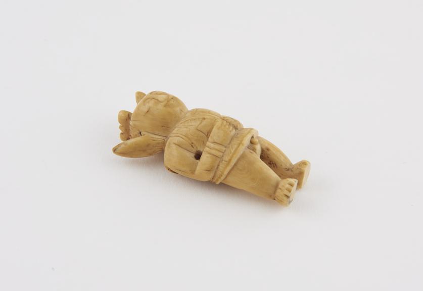 Ivory netsuke, in the form of a man, standing