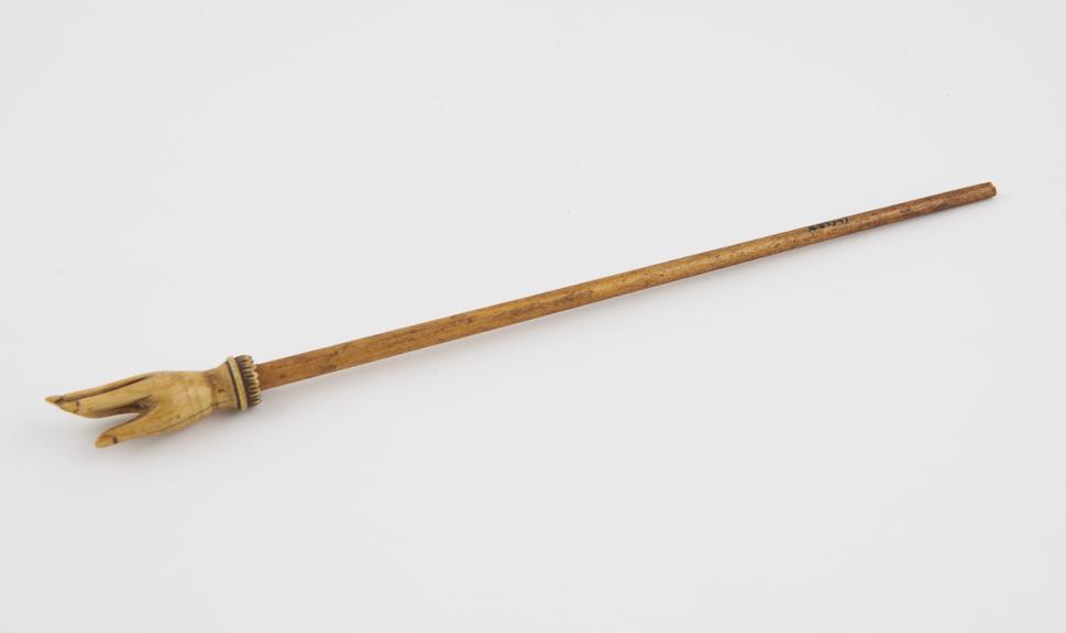 Wood and ivory back scratcher