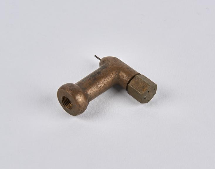 Metal elbow component from White steam car, 1907