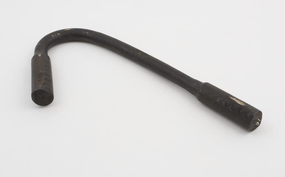 Tensile testbar, manganese steel (bent after testing), 13