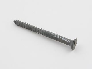 A wood screw illustrating the Sherardizing process.