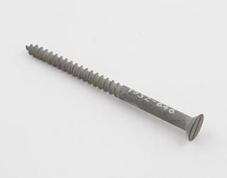 A wood screw illustrating the Sherardizing process.