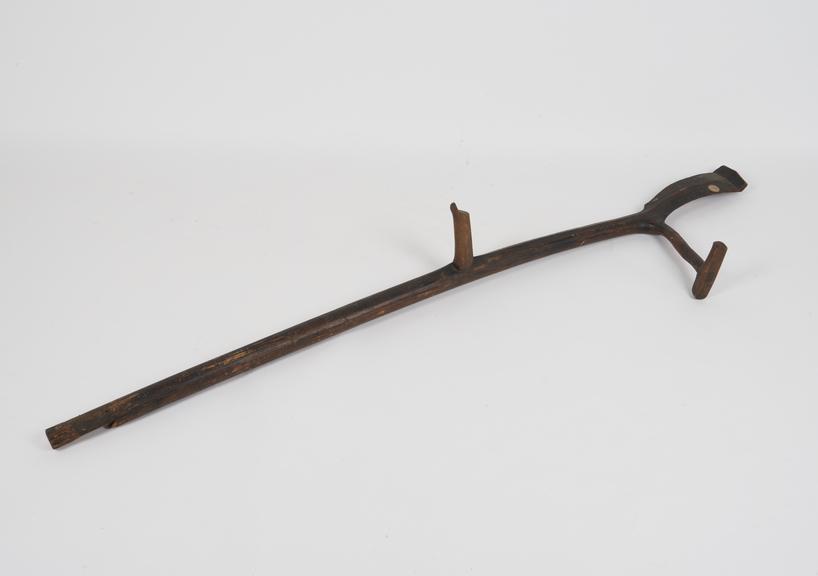 Long carved, wooden crutch, with crutch for neck