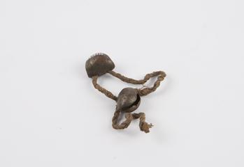 Two iron bells attached to string bracelet for children