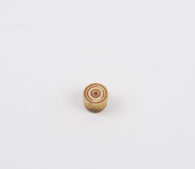 Small lip stud made from hippopotamus ivory, cylindrical with