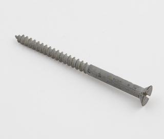 A wood screw illustrating the Sherardizing process.