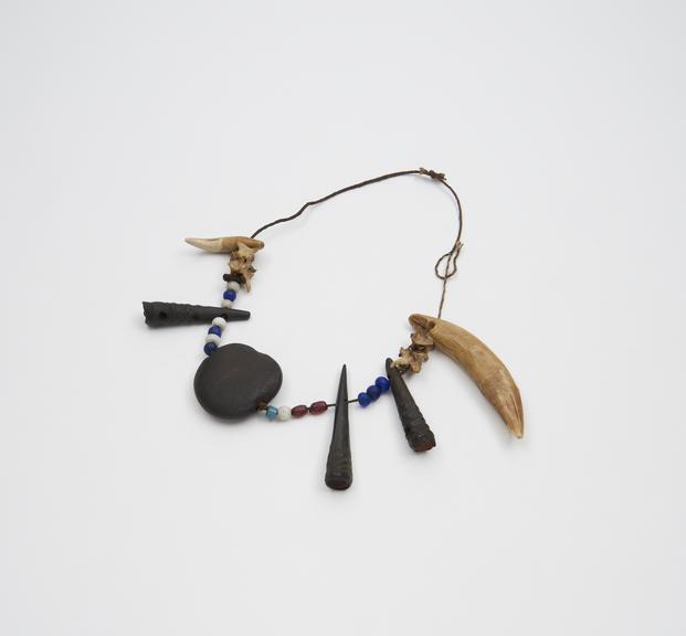 Amuletic horns, teeth, beads